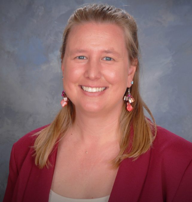 Montessori Director in San Diego blonde with red jacket