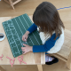 Toddler in Montessori Preschool learning cursive