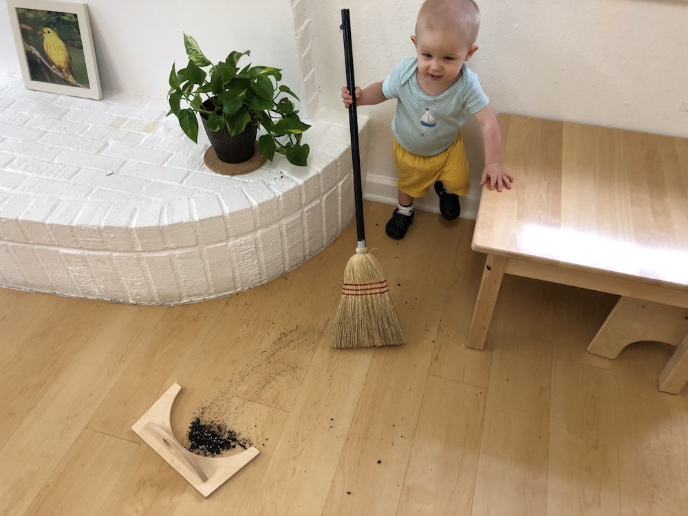 Toddler Sweeping with a broom independently