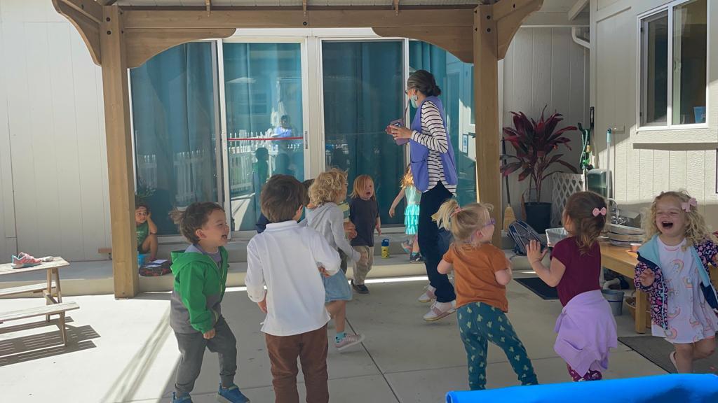 Children dancing to music at La Jolla Montessori school