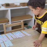 Montessori Child Giving Parents a Math Lesson at La Jolla Montessori School