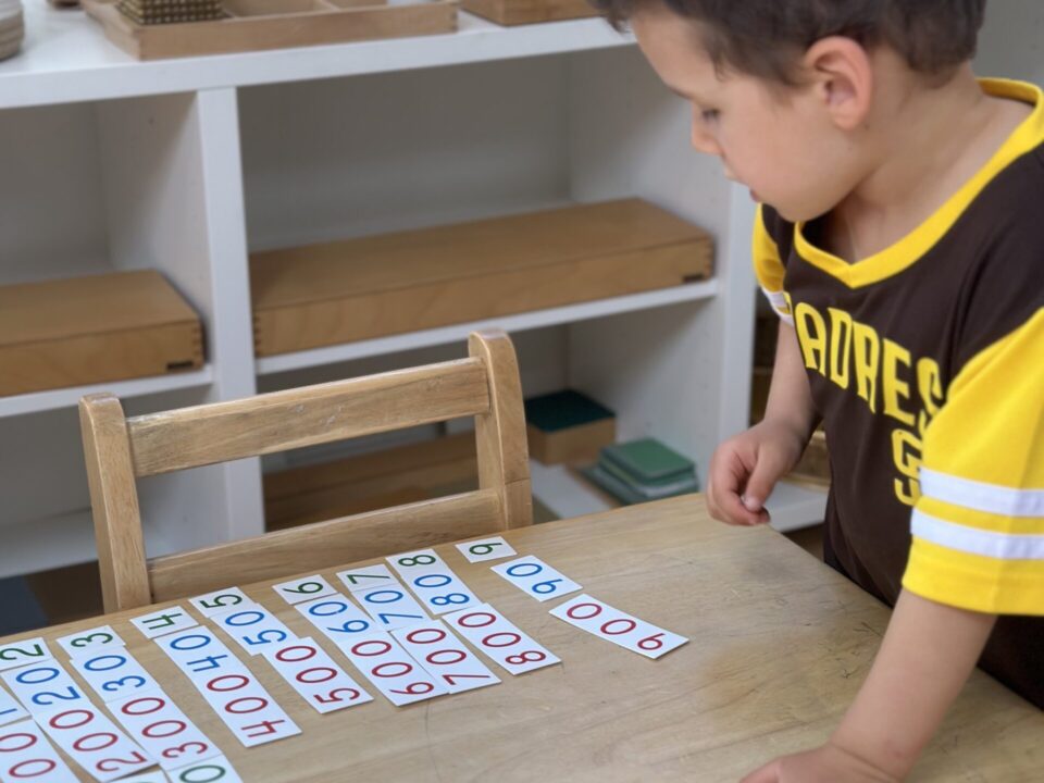 Montessori Child Giving Parents a Math Lesson at La Jolla Montessori School