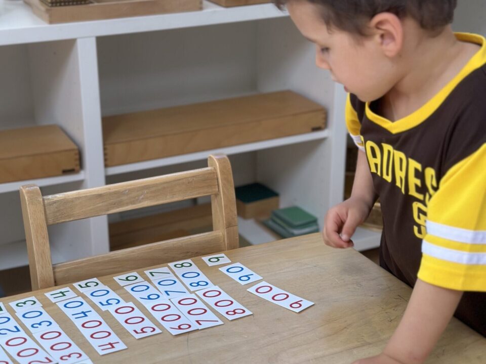 Montessori Child Giving Parents a Math Lesson at La Jolla Montessori School