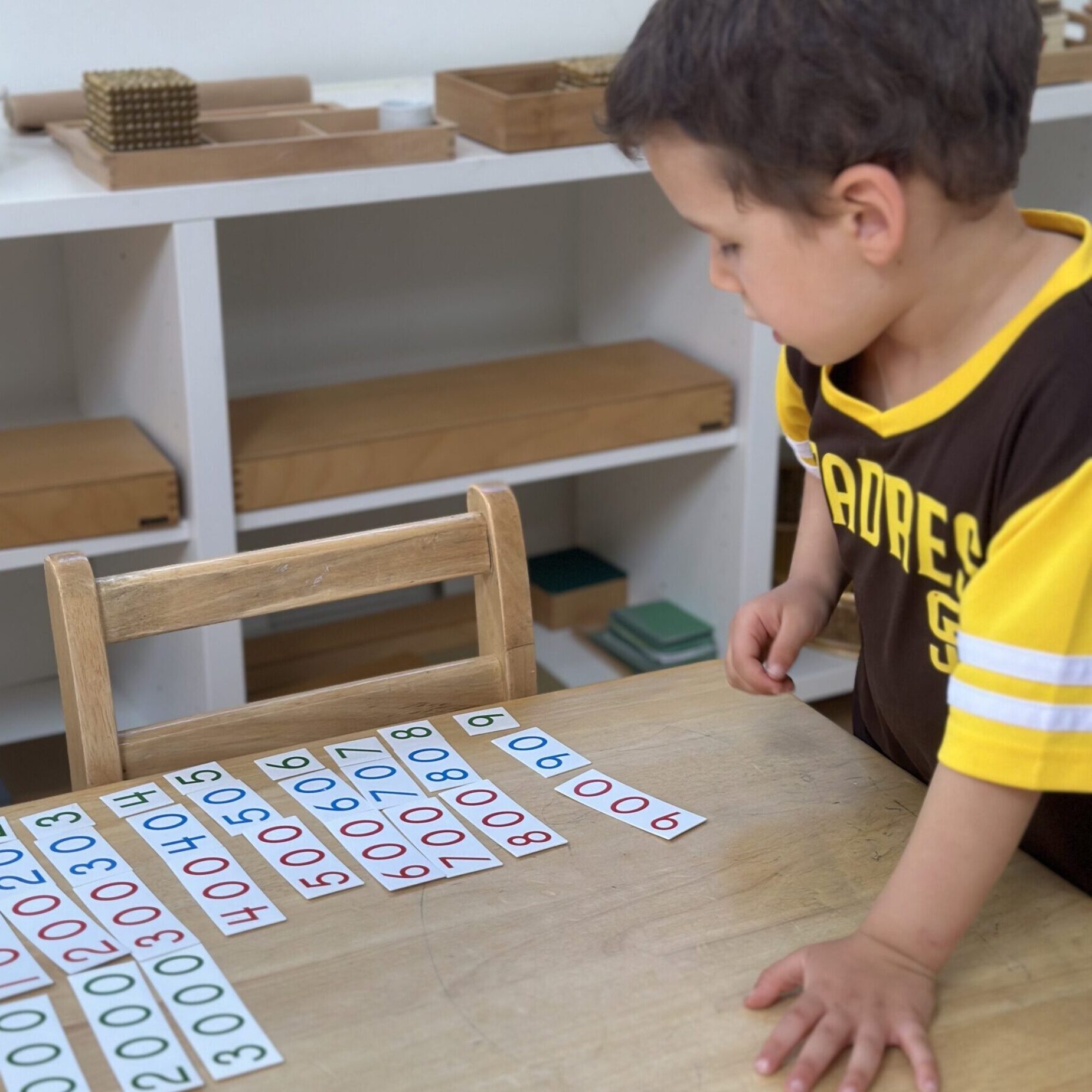 Montessori Child Giving Parents a Math Lesson at La Jolla Montessori School