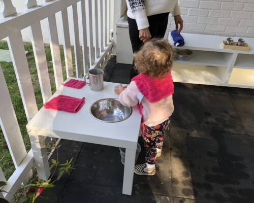 Toddler washing hands independently