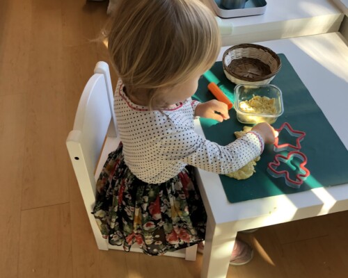 Toddler playing with dough