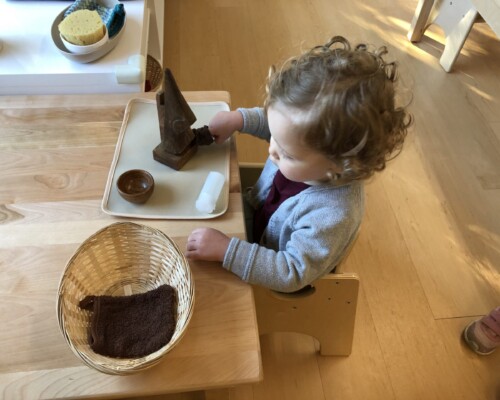 Toddler cleaning independently