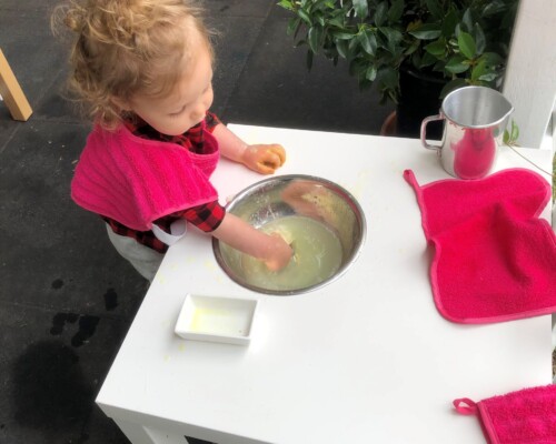 Toddler washing hands independently