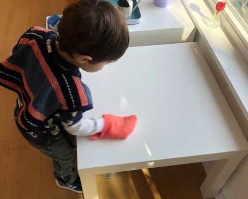 Toddler cleaning independently