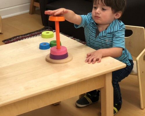 Toddler solving puzzles