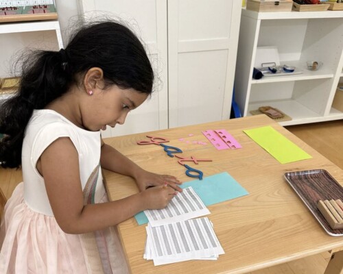 Girl writing in Spanish at a Bilingual Preschool in La Jolla