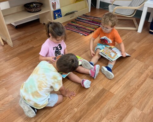 Primary Social Development reading together at La Jolla Montessori