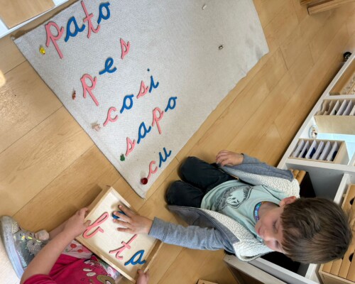 Child learning to write and read in Spanish at Bilingual Preschool in La Jolla