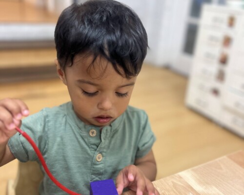 Toddler Sensory Area Stringing Beads at La Jolla Montessori