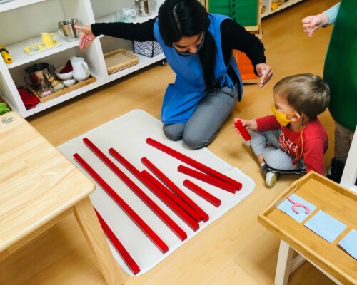 Boy learning math with Teacher guidance at La Jolla Montessori School.jpg