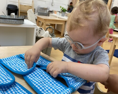 Boy learning to Velcro