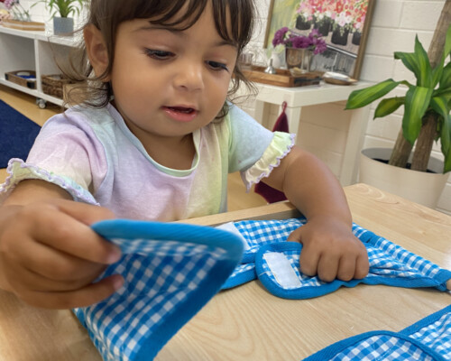 Girl learning to velcro 2 Preschool