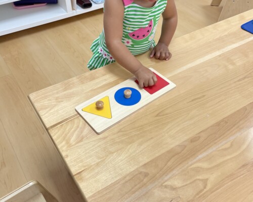 Girl playing with shapes Preschool