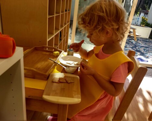 Toddler preparing a snack independently